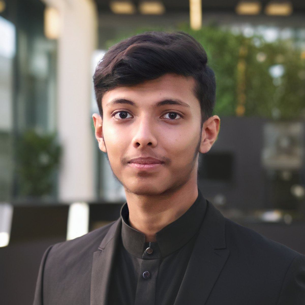Arkadeep in a black jacket, looking into the lens