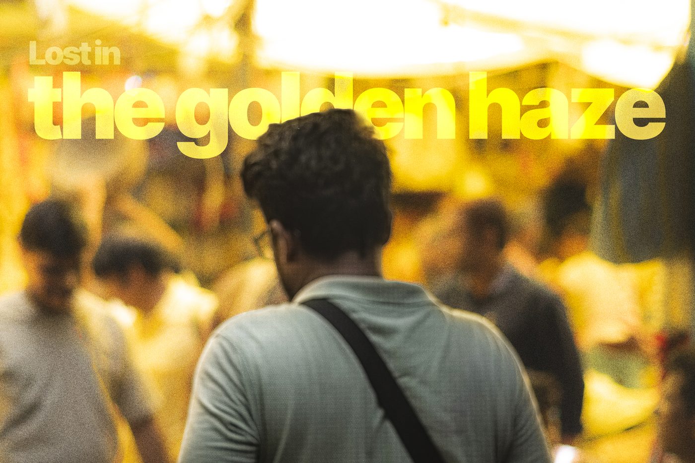 A man seen from behind in a crowded market lit gold, captioned Lost in the golden haze
