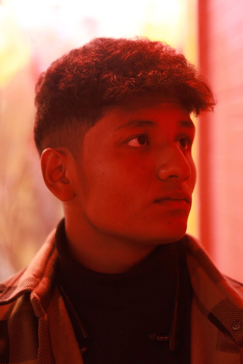 A portrait under a single red light